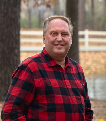 Portrait of Norman Reid, REALTOR®, GRI, ABR.