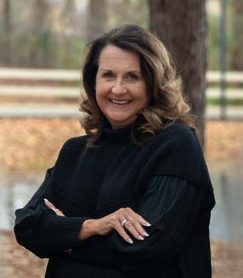Portrait of Tami Reid, REALTOR®, GRI, ABR.