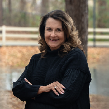 Portrait of Tami Reid, REALTOR®, GRI, ABR